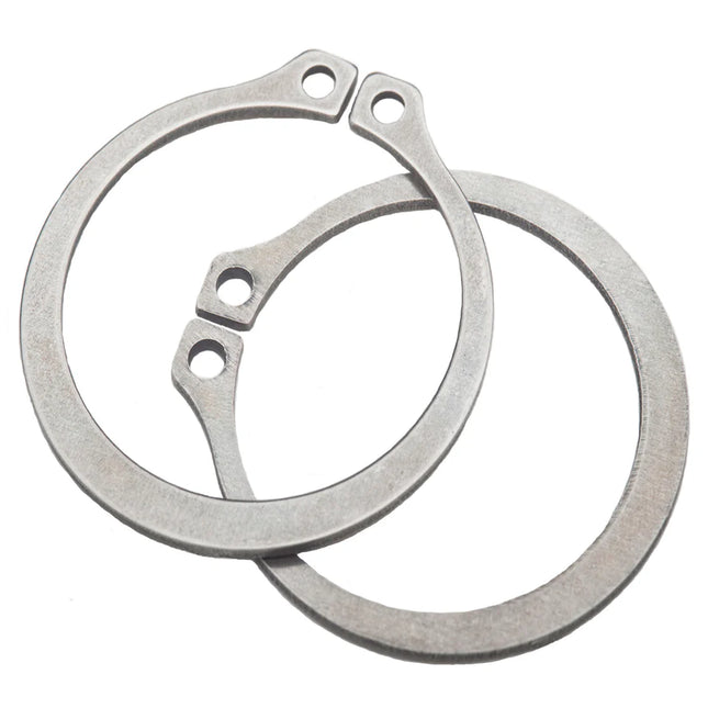 Two metal gaskets on a white background