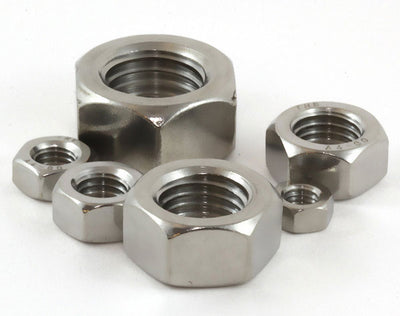 Set of metal hex nuts on a white background