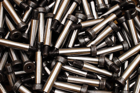 Close-up of a pile of metal bolts and screws.