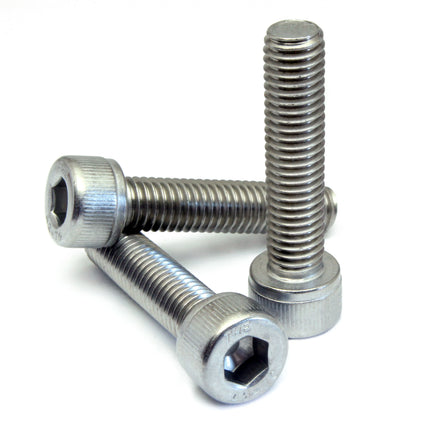 Three metal screws on a white background