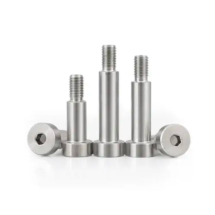 Set of stainless steel screws on a white background