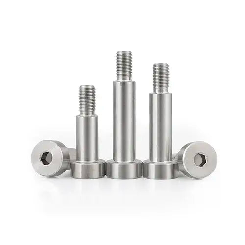Set of stainless steel screws on a white background